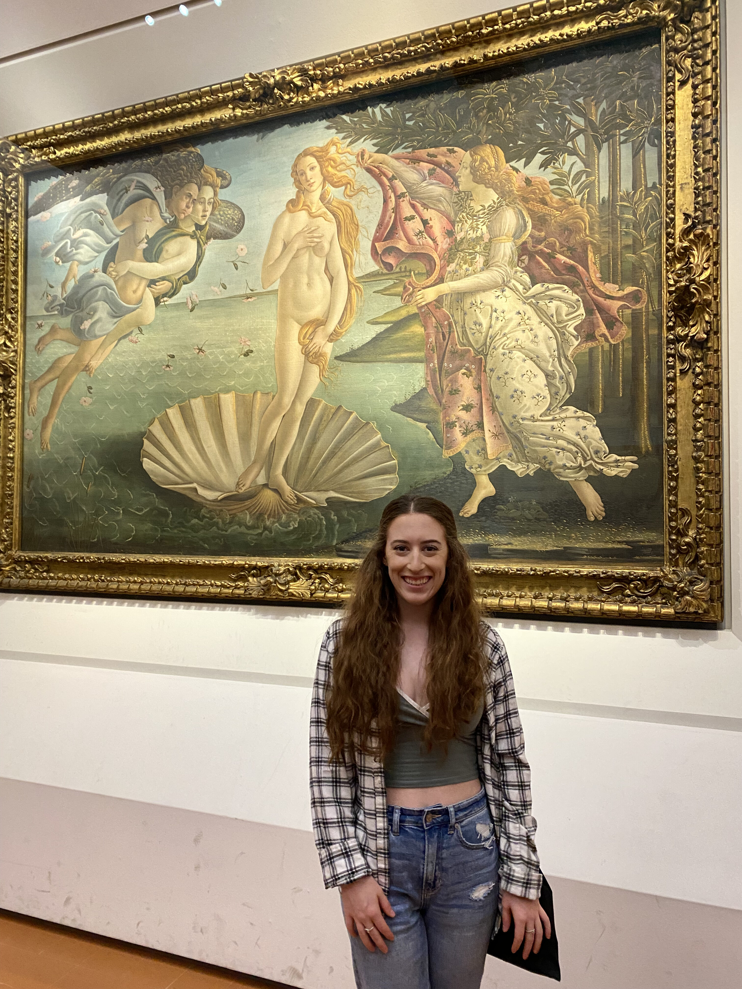 Bella standing in front of her favorite painting at the Uffizi Gallery – The Birth of Venus by Botticelli.