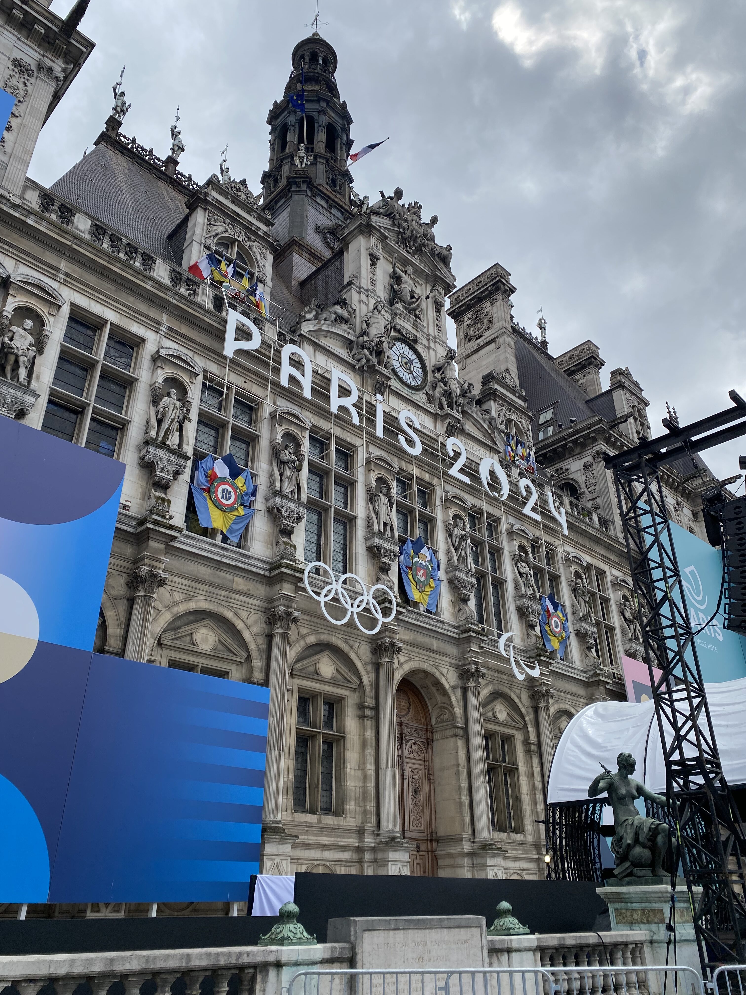 The ornate Hôtel de Ville, decorated for the 2024 Paris Olympics. The facade contains the words, "Paris 2024" across the front.