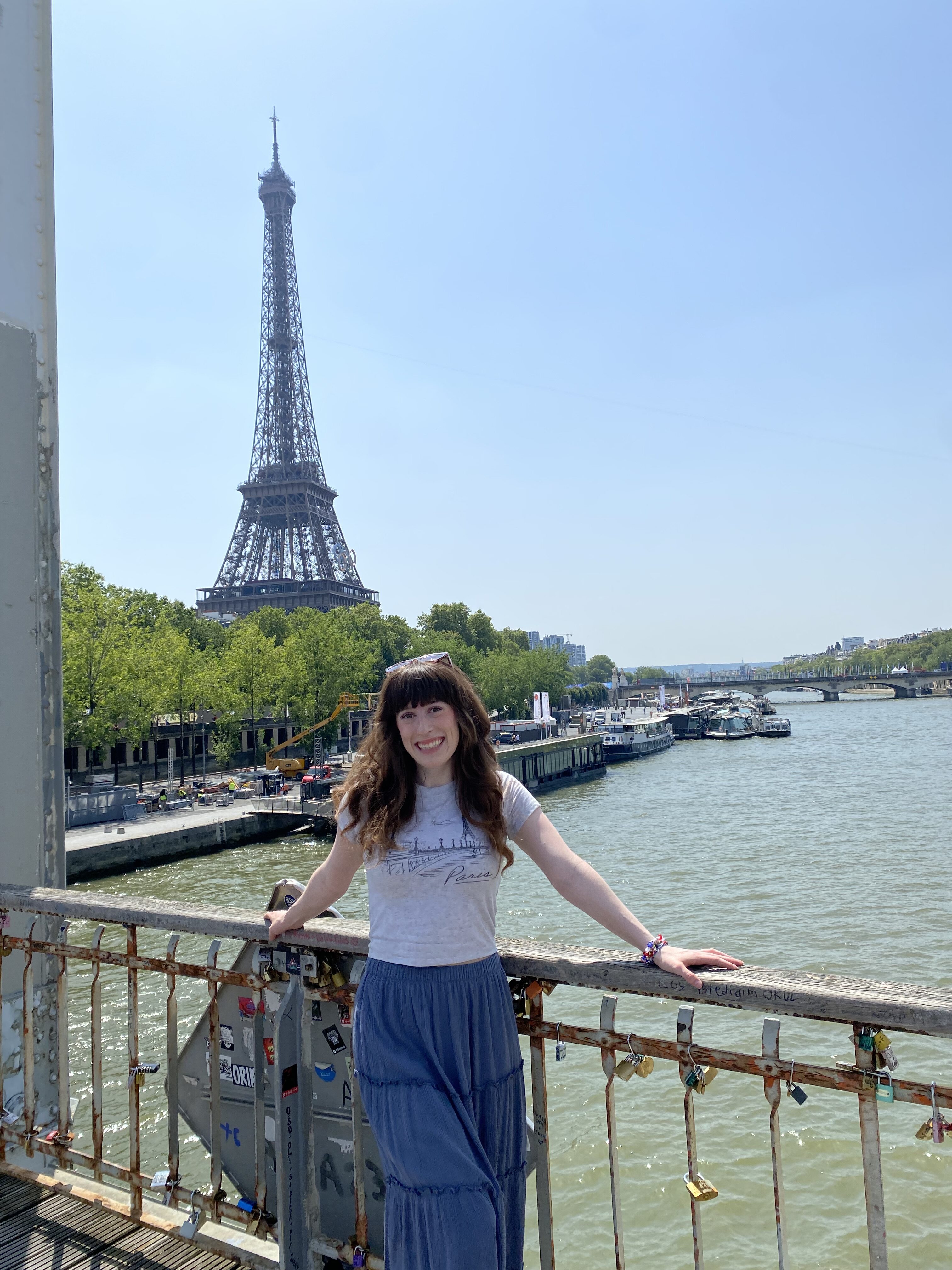 Bella poses on Passerelle Debilly Bridge just across the Seine river in the 7th Arrondissement – A great place to stay in Paris