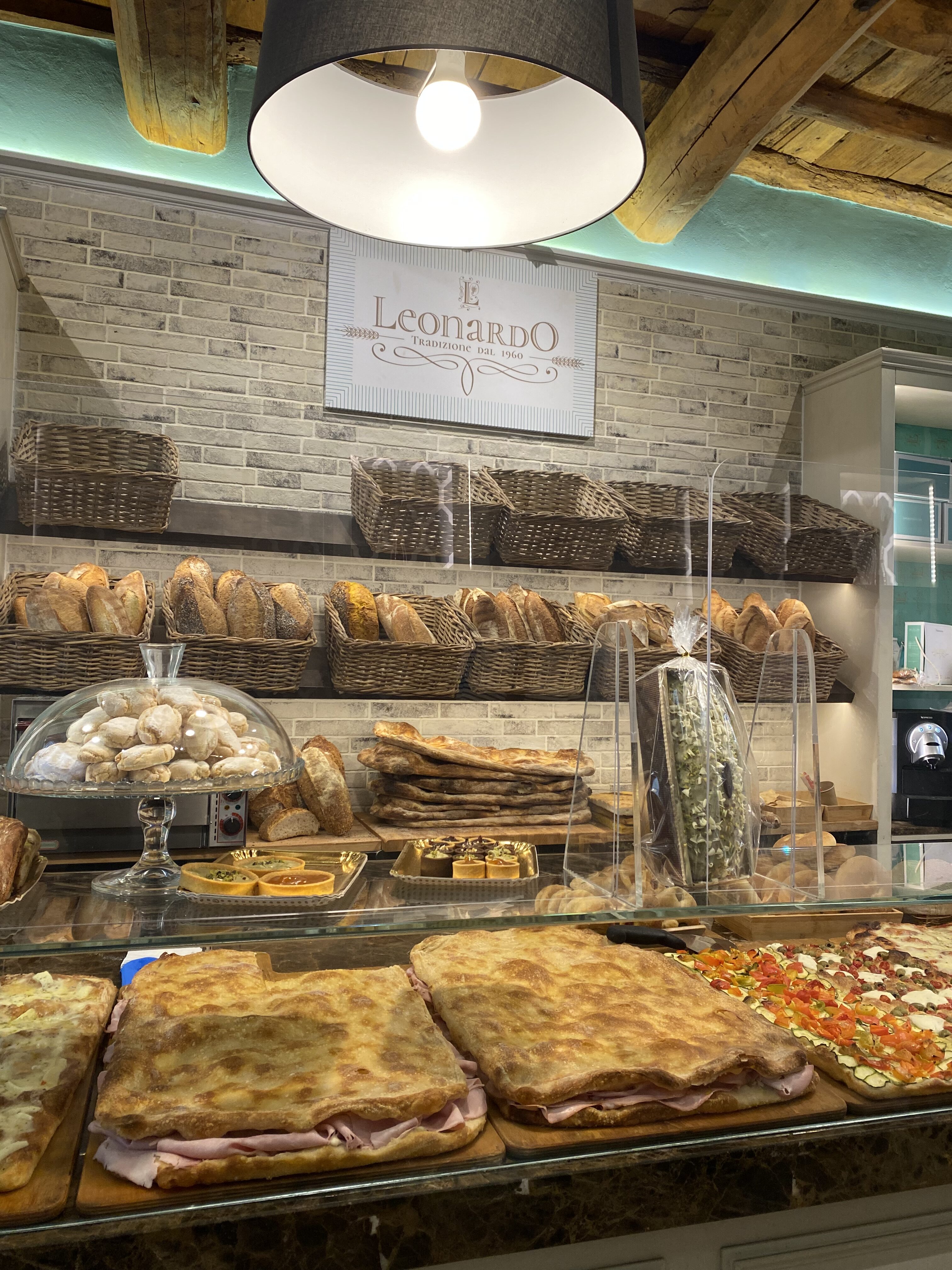 A beautiful display of Florentine pastries beneath a sign that reads, "Leonardo, Tradizione dal 1960"