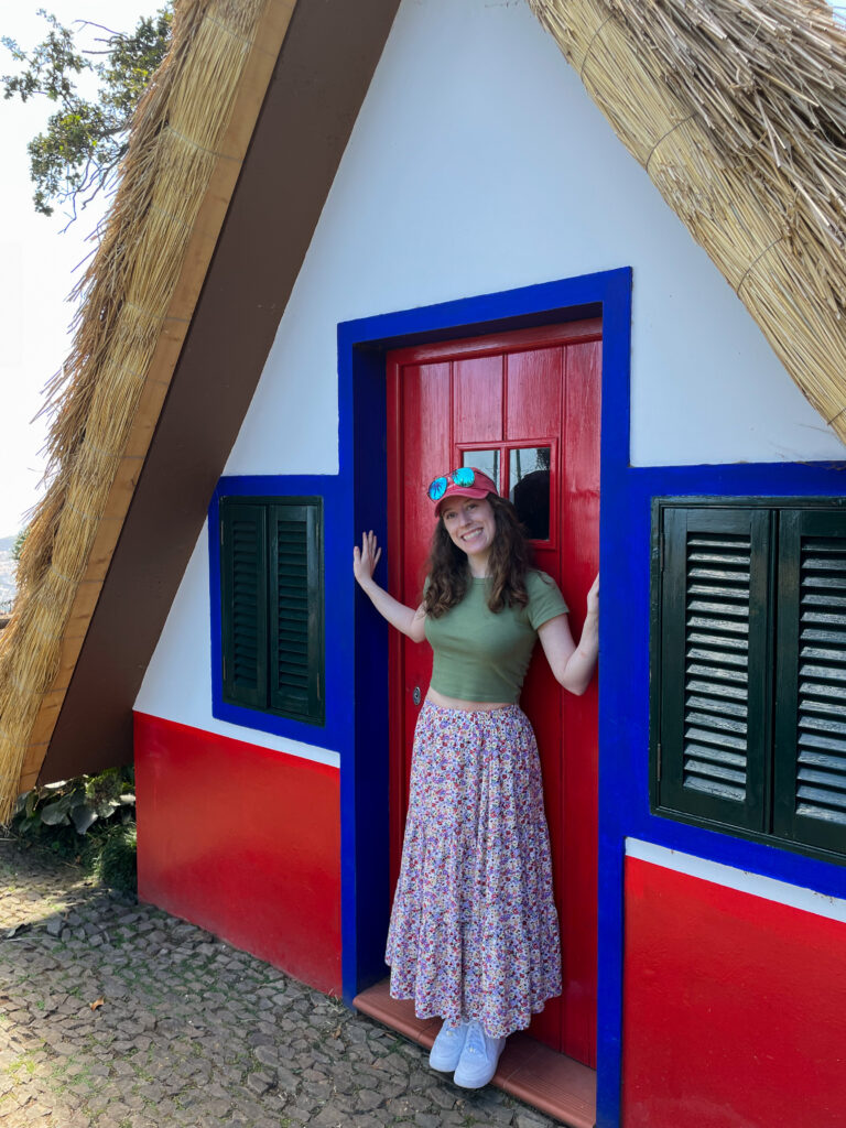 Bella posing in the doorway of a Santana house in Madeira.