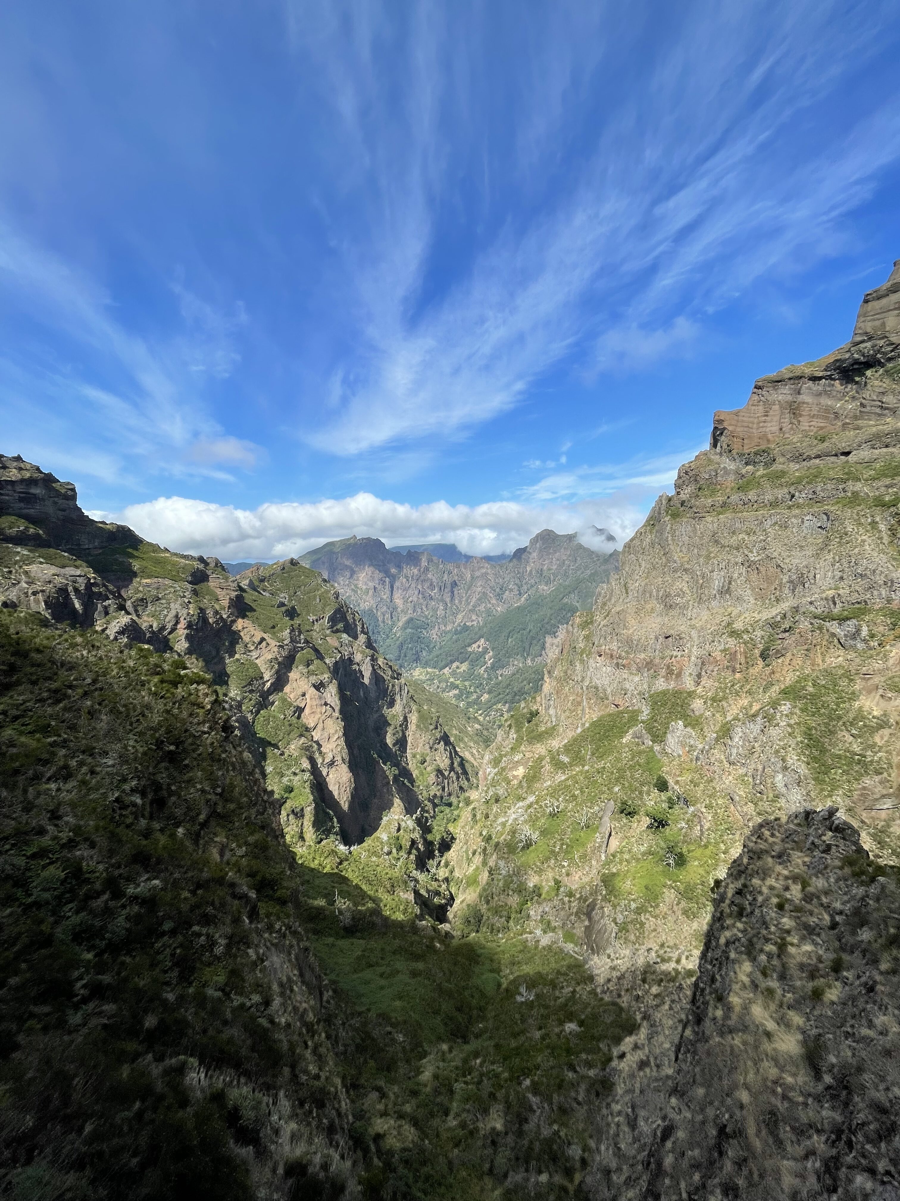 Pico Ruivo trail view with streaking clouds.