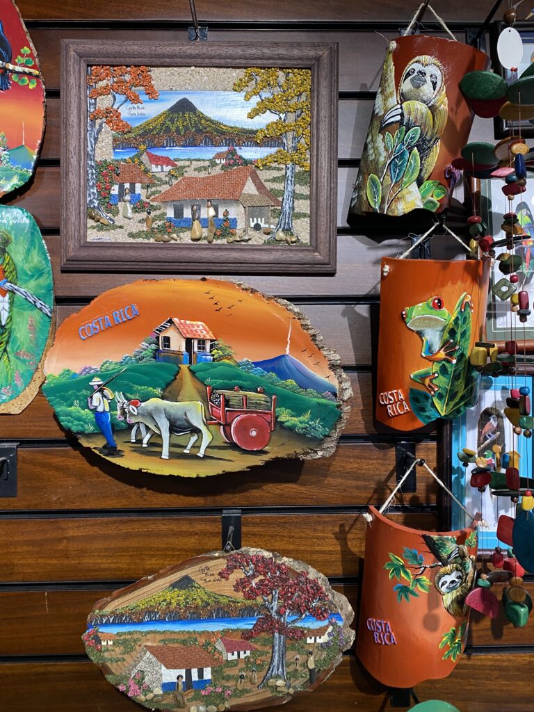 Colorful, handprinted souvenirs from Costa Rican with decorative scenes.