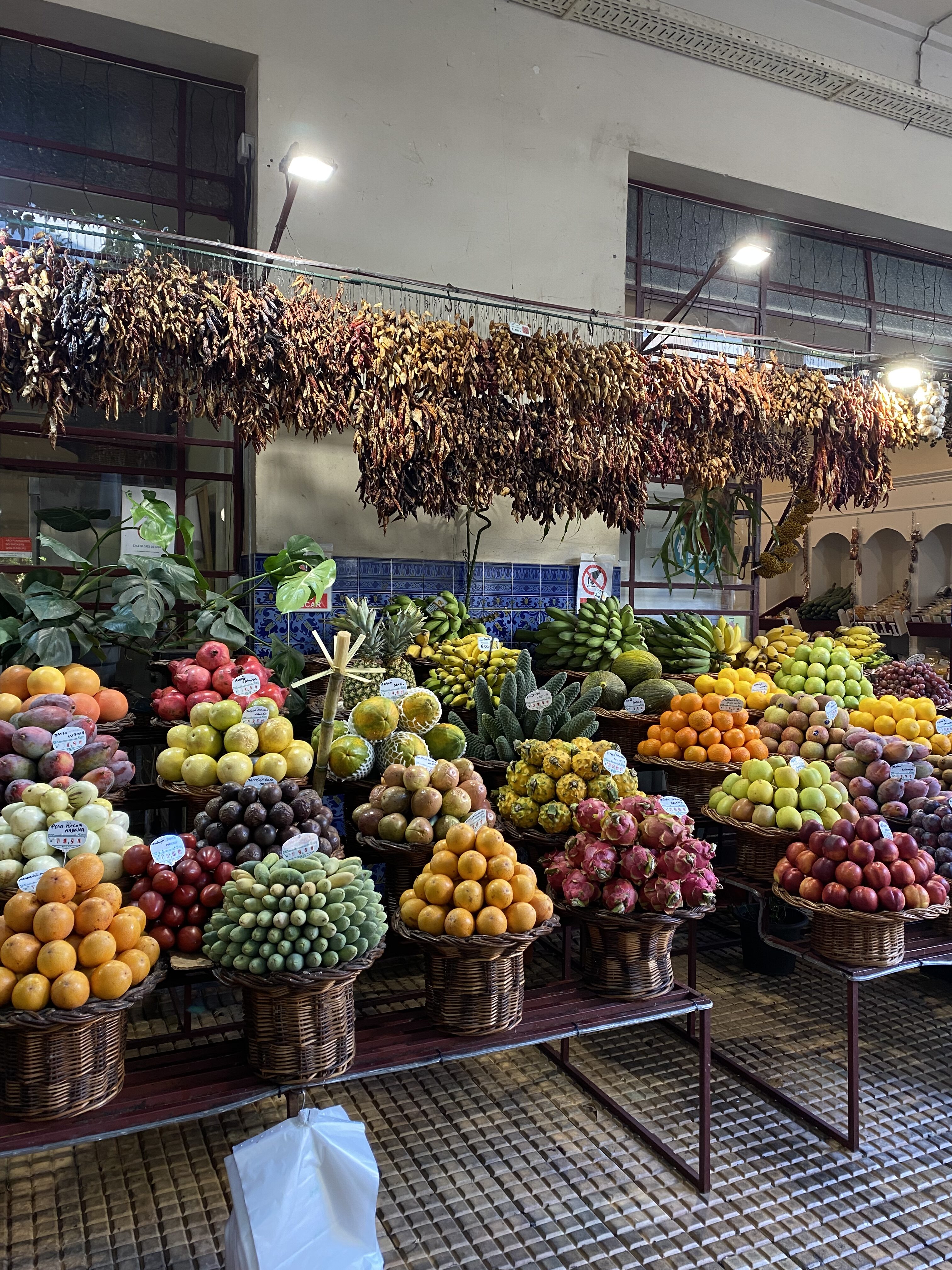 A collection of fruits at Mercado dos Lavradores, a local farmers market in Madeira.