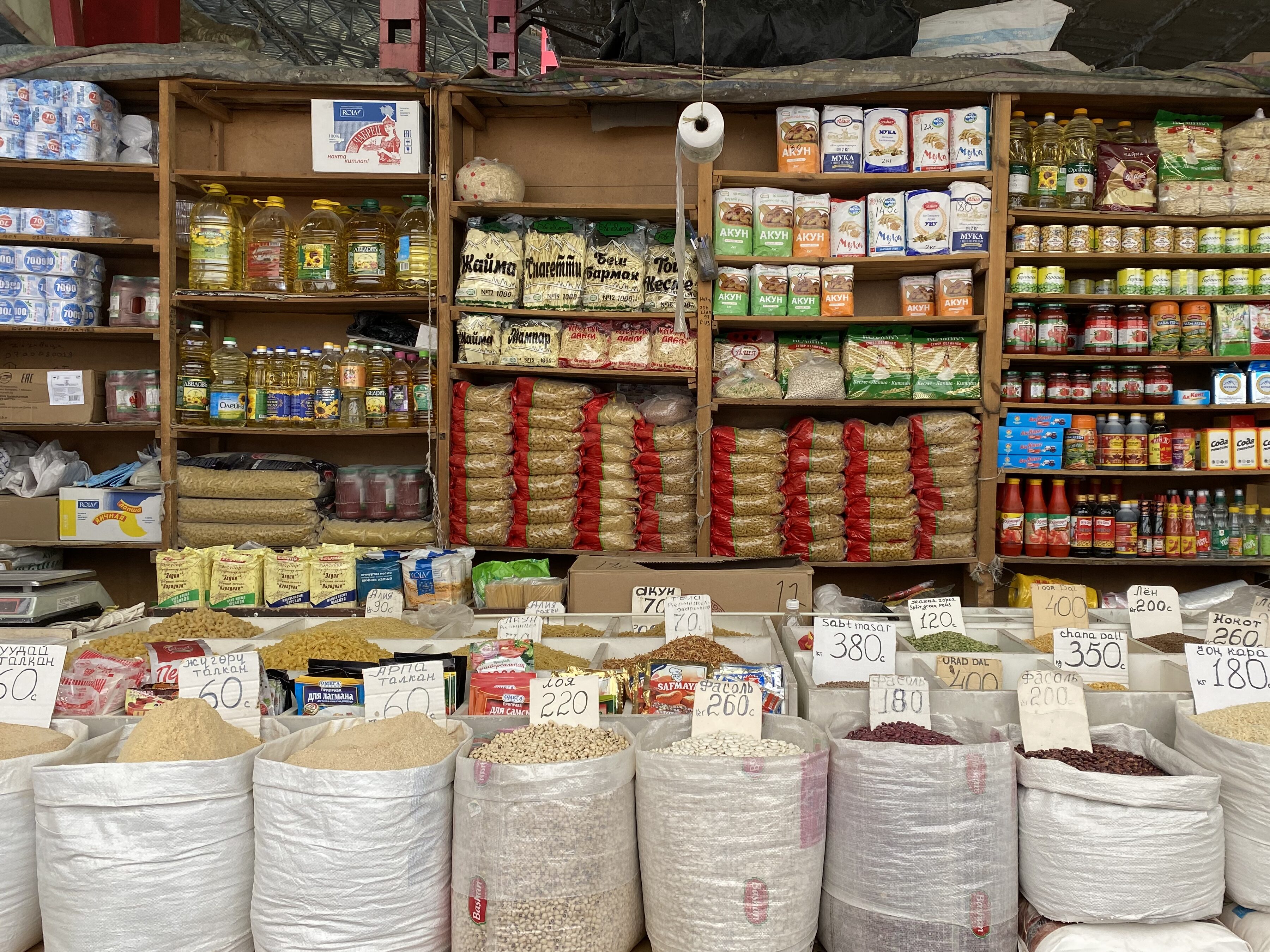 A decorative display of local spices and products at the Osh Bazaar.