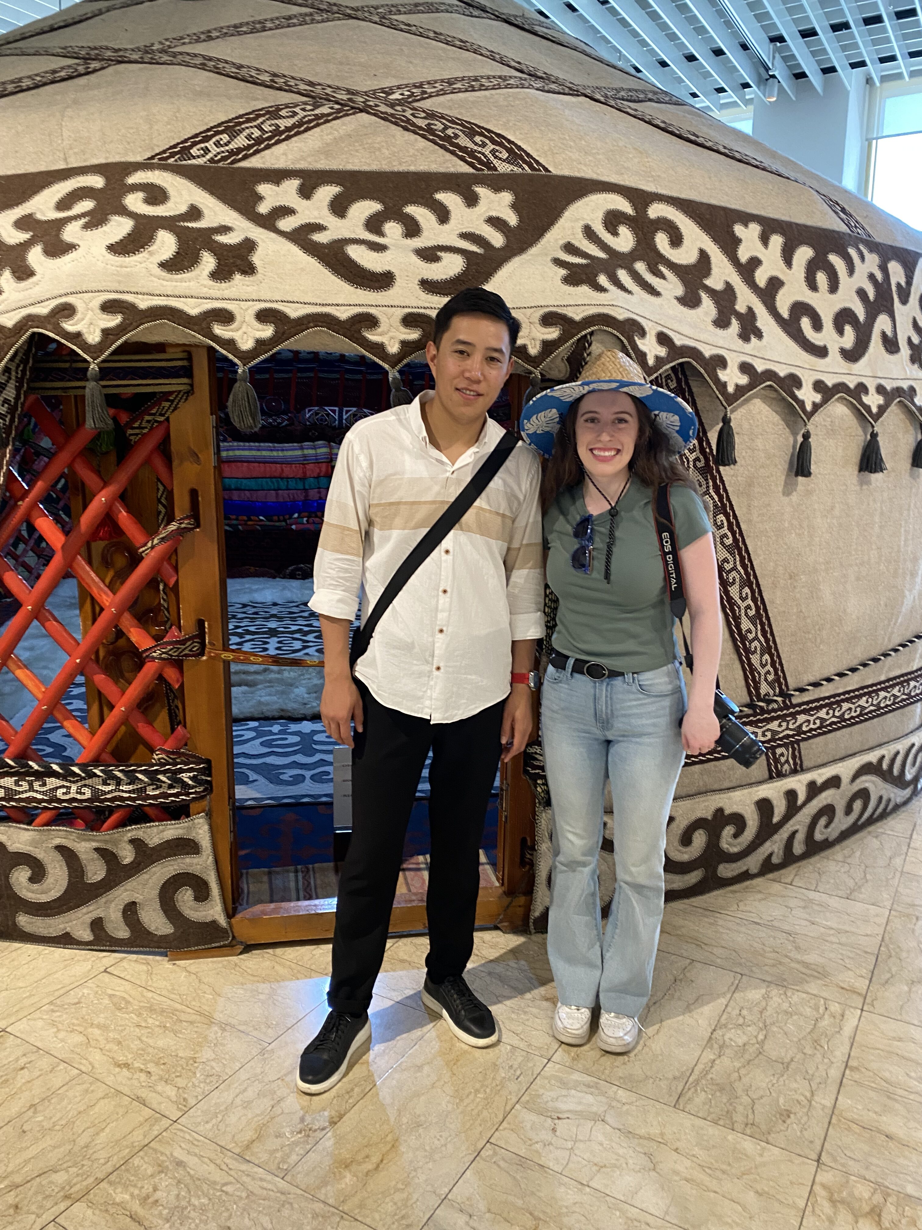 Bella and Suiunbek in front of a yurt display at the state History Museum of Kyrgyzstan.