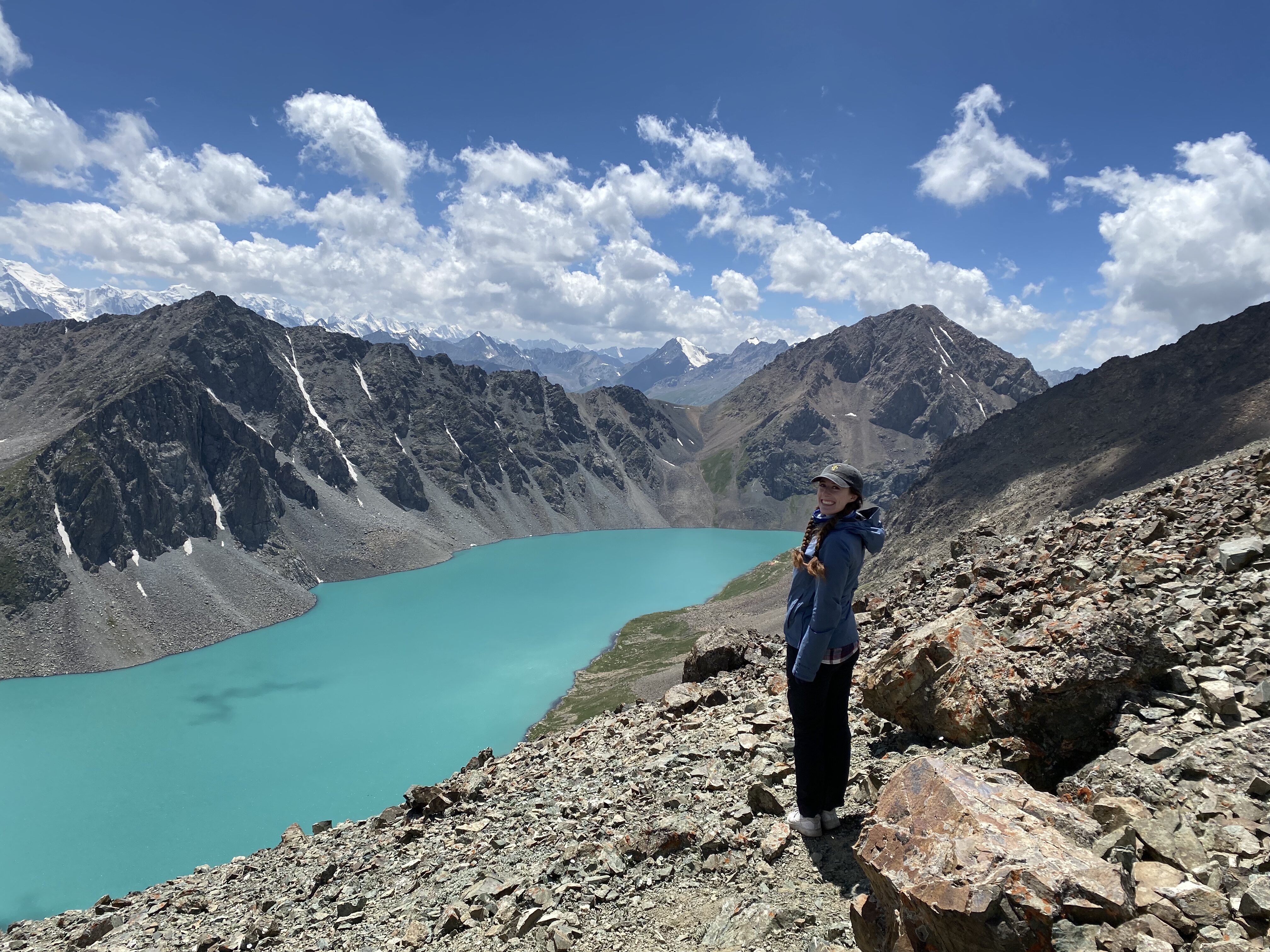 Bella at the top of Ala Kul pass, with the turquoise lake below.