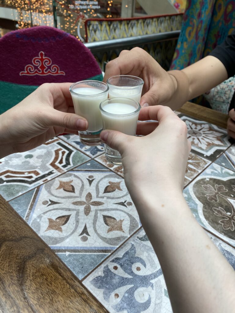 Three small "shot" glasses of chalap – a sour Kyrgyz drink.