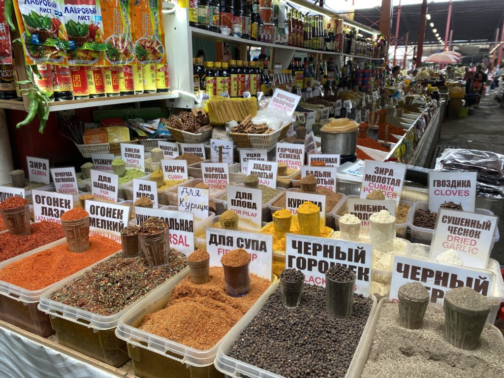 A collection of spice and souvenirs at a stall at Osh Bazaar.