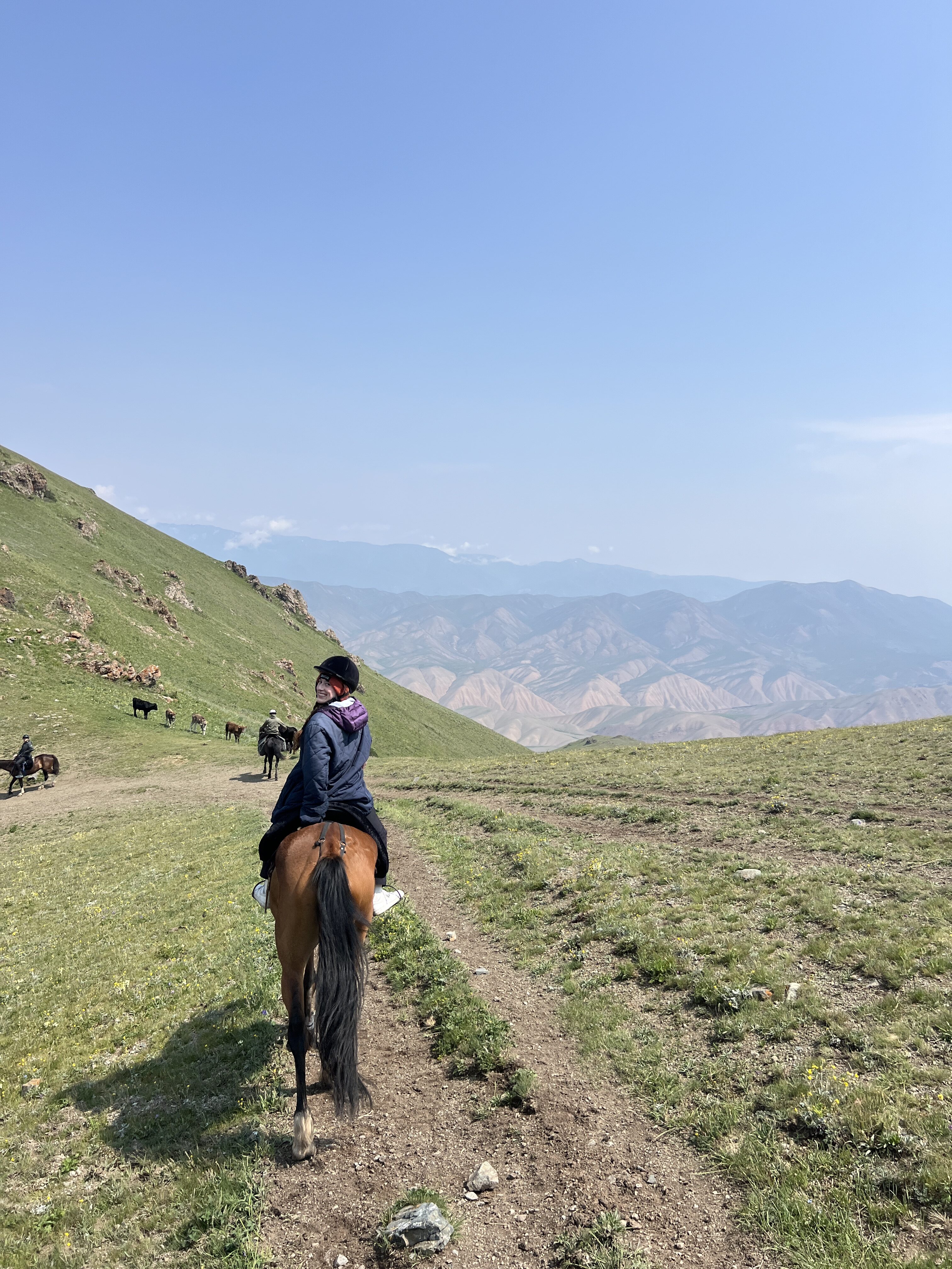 Bella riding at the top of Kara-Kiya pass, just outside of Kyzart village.