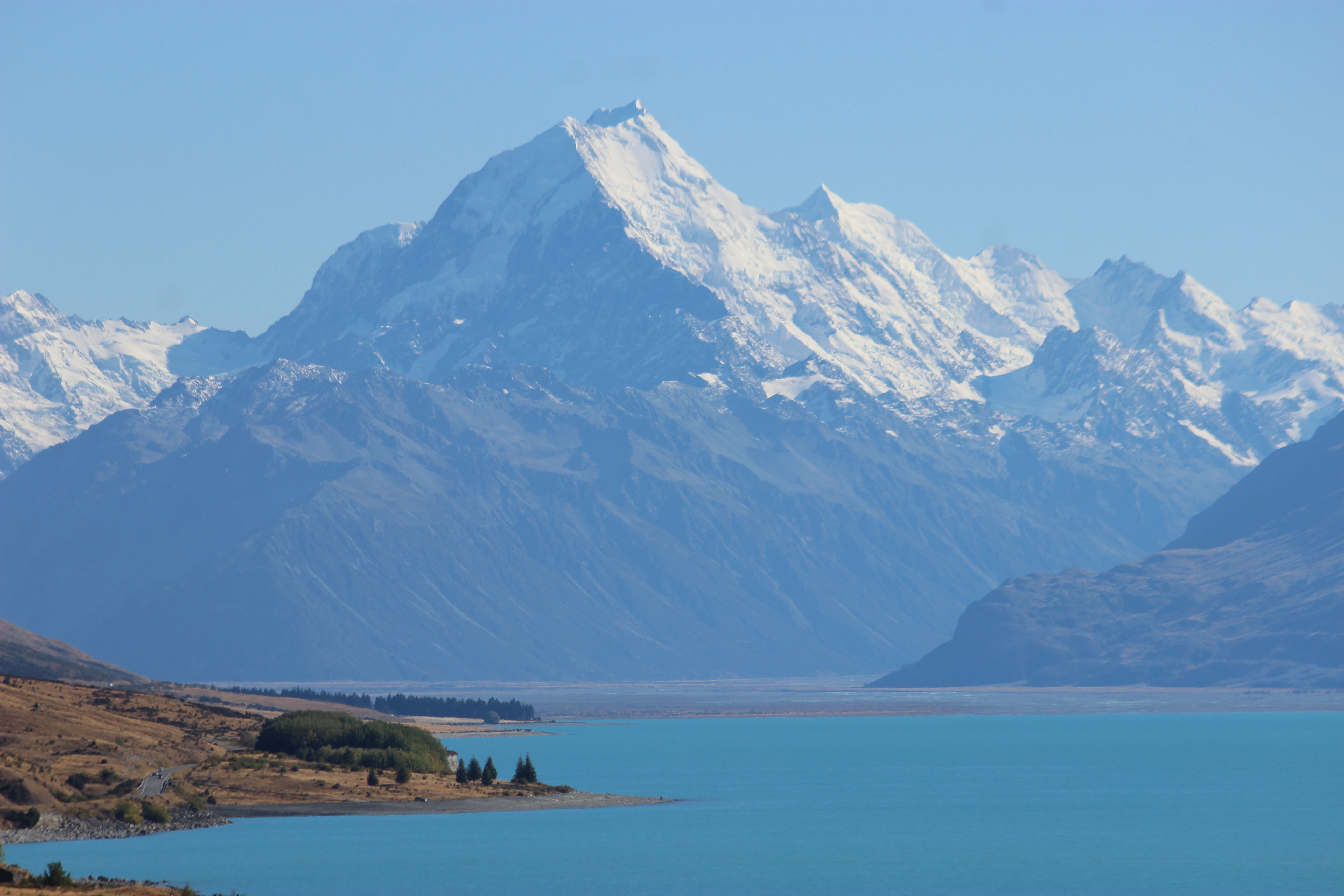 The stunningly blue, snow-capped Aoraki/Mt. Cook towering over Lake Pukaki.