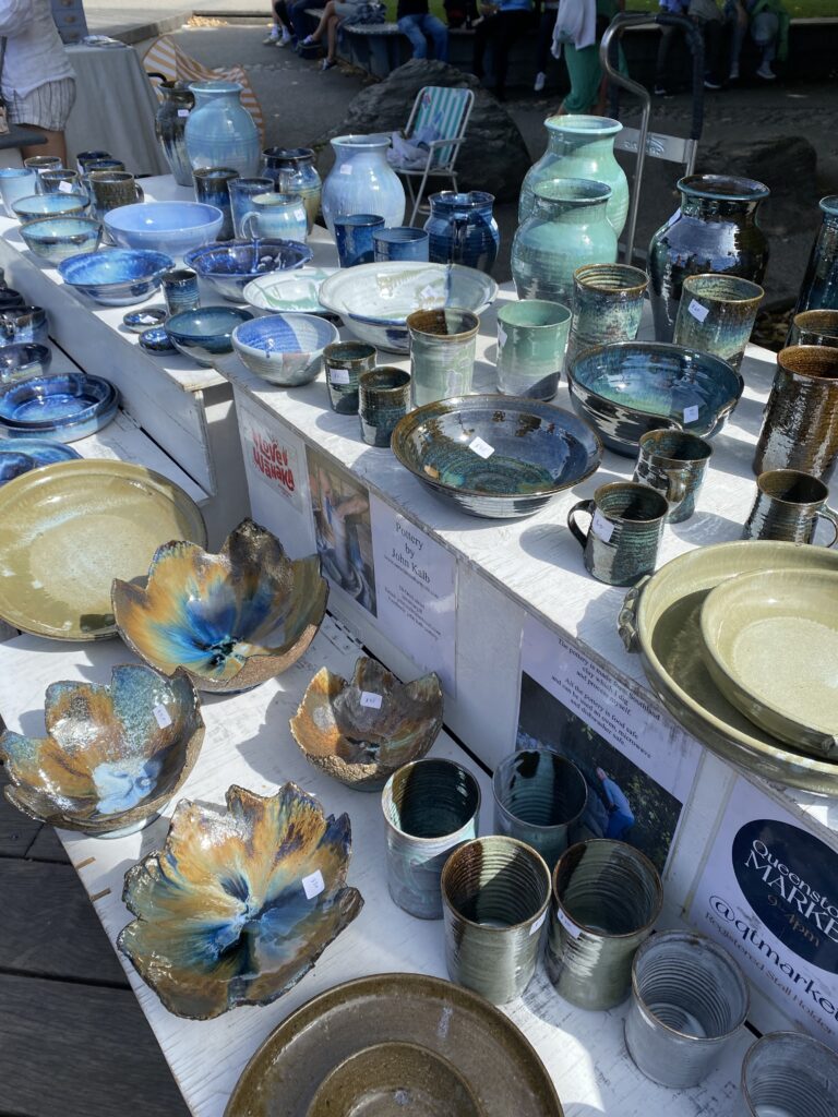 Colorful blue ceramics at an artisan craft fair in Queenstown.