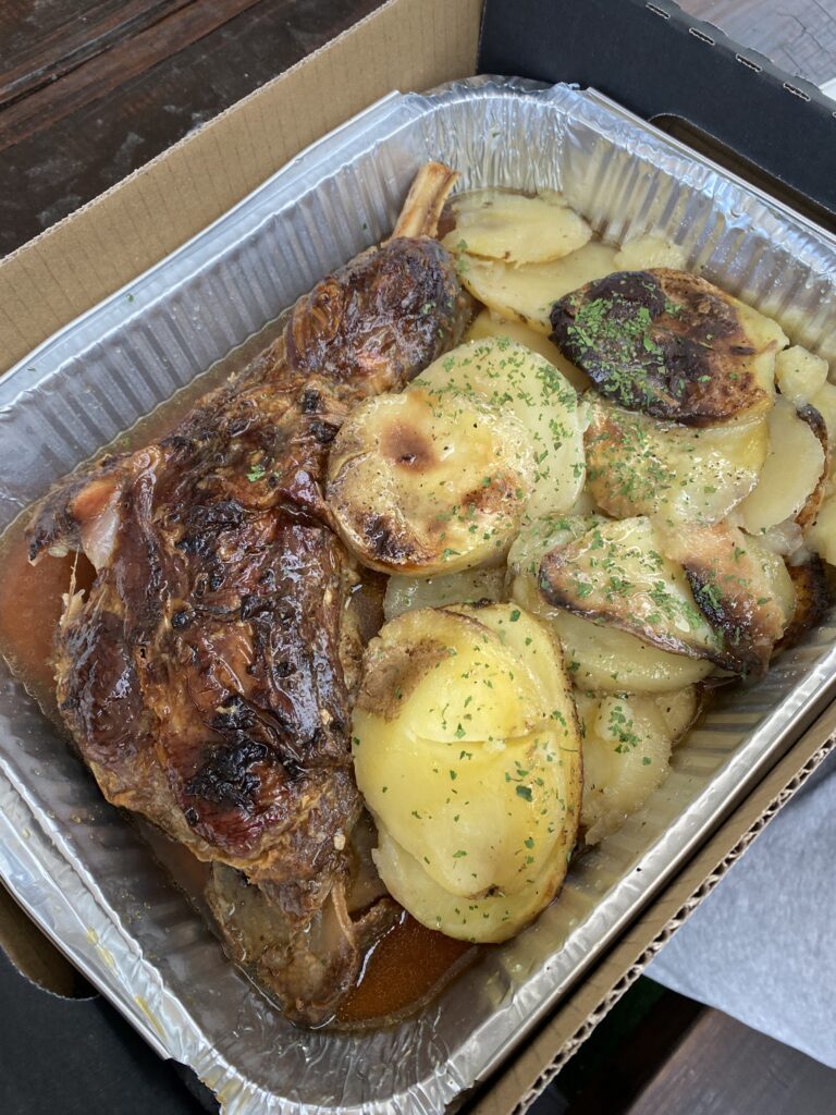 A juicy lamb dinner with sliced potatoes from Pedro's House of Lamb.