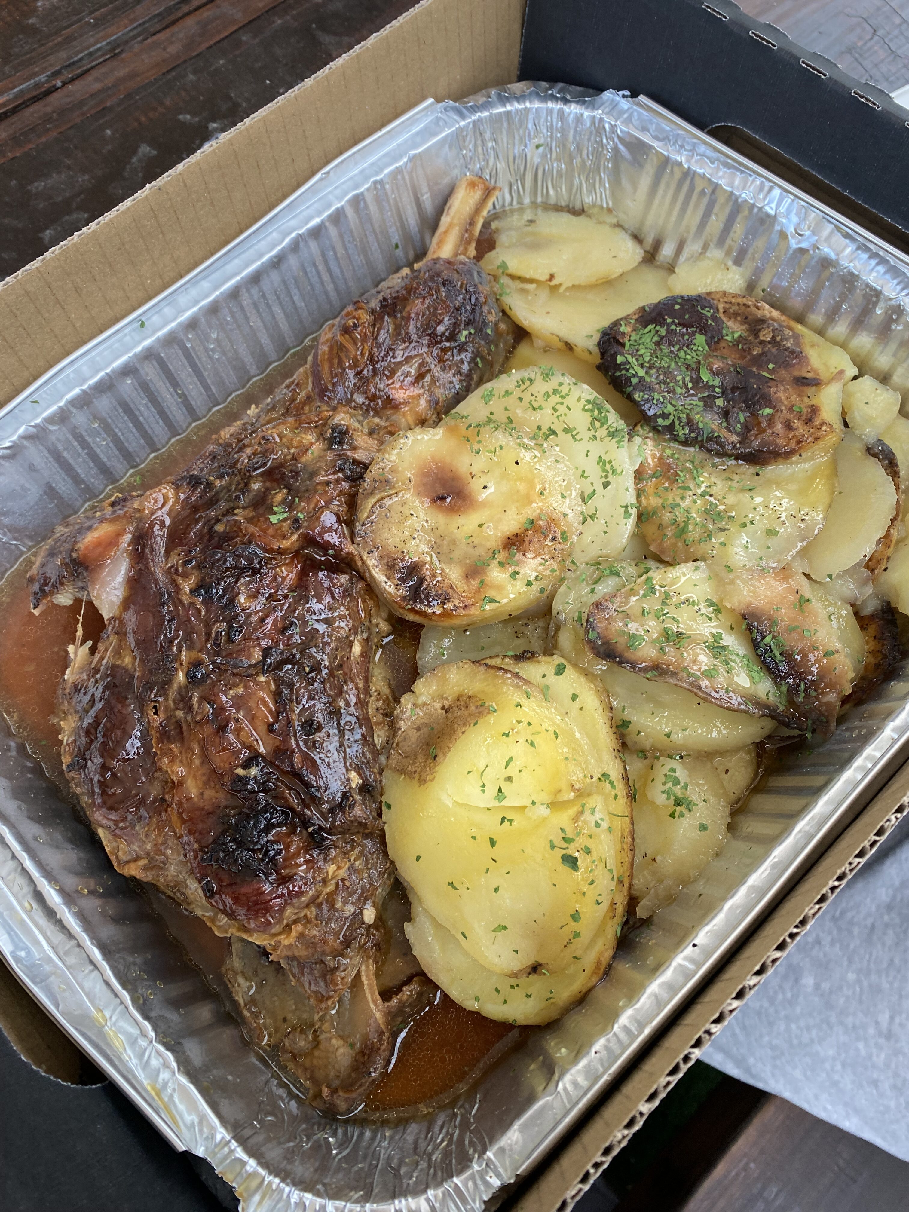 A juicy lamb dinner with sliced potatoes from Pedro's House of Lamb.