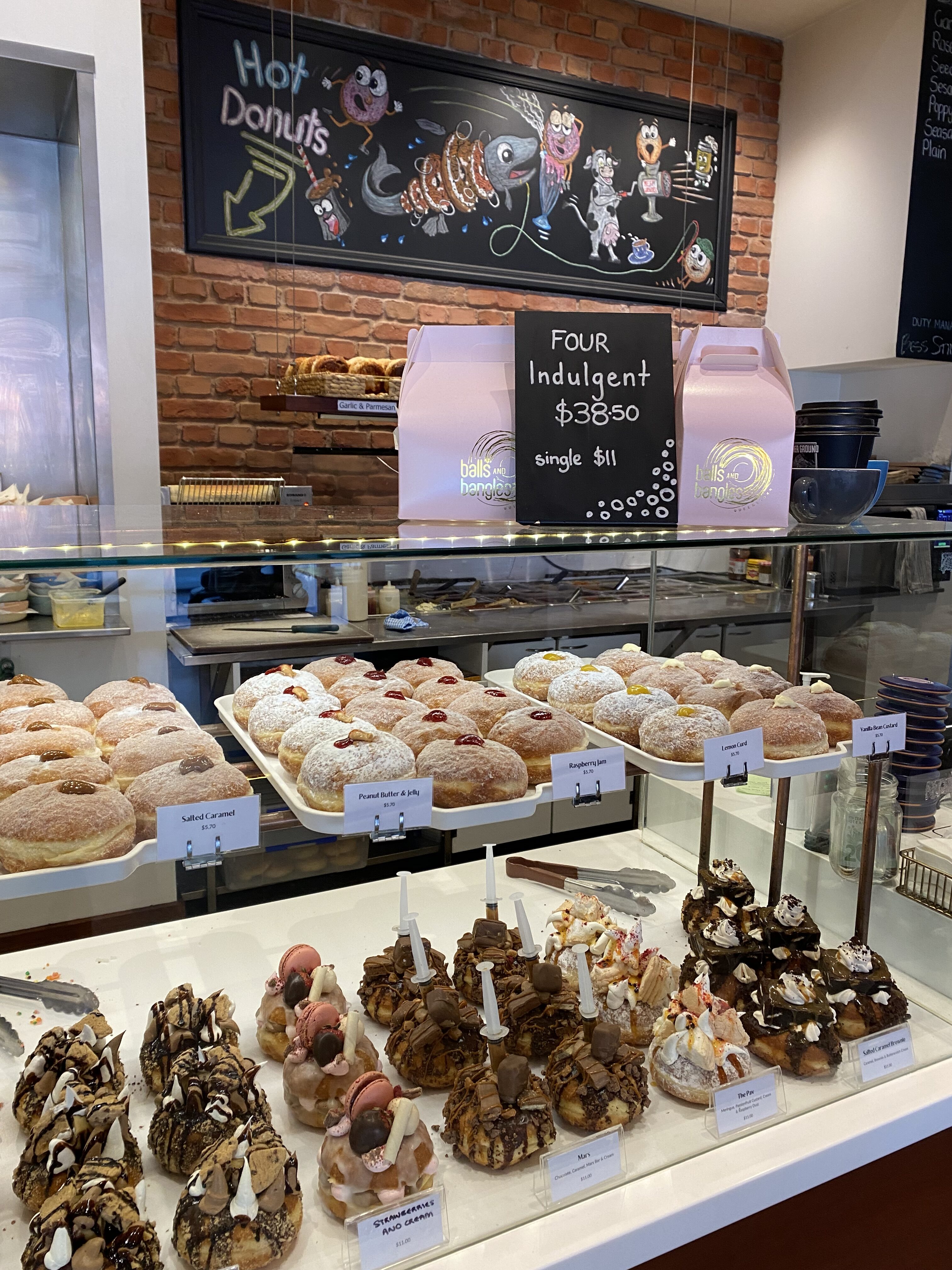 A mouthwatering array of local donuts of all flavors and designs at Balls and Bangles in Queenstown.