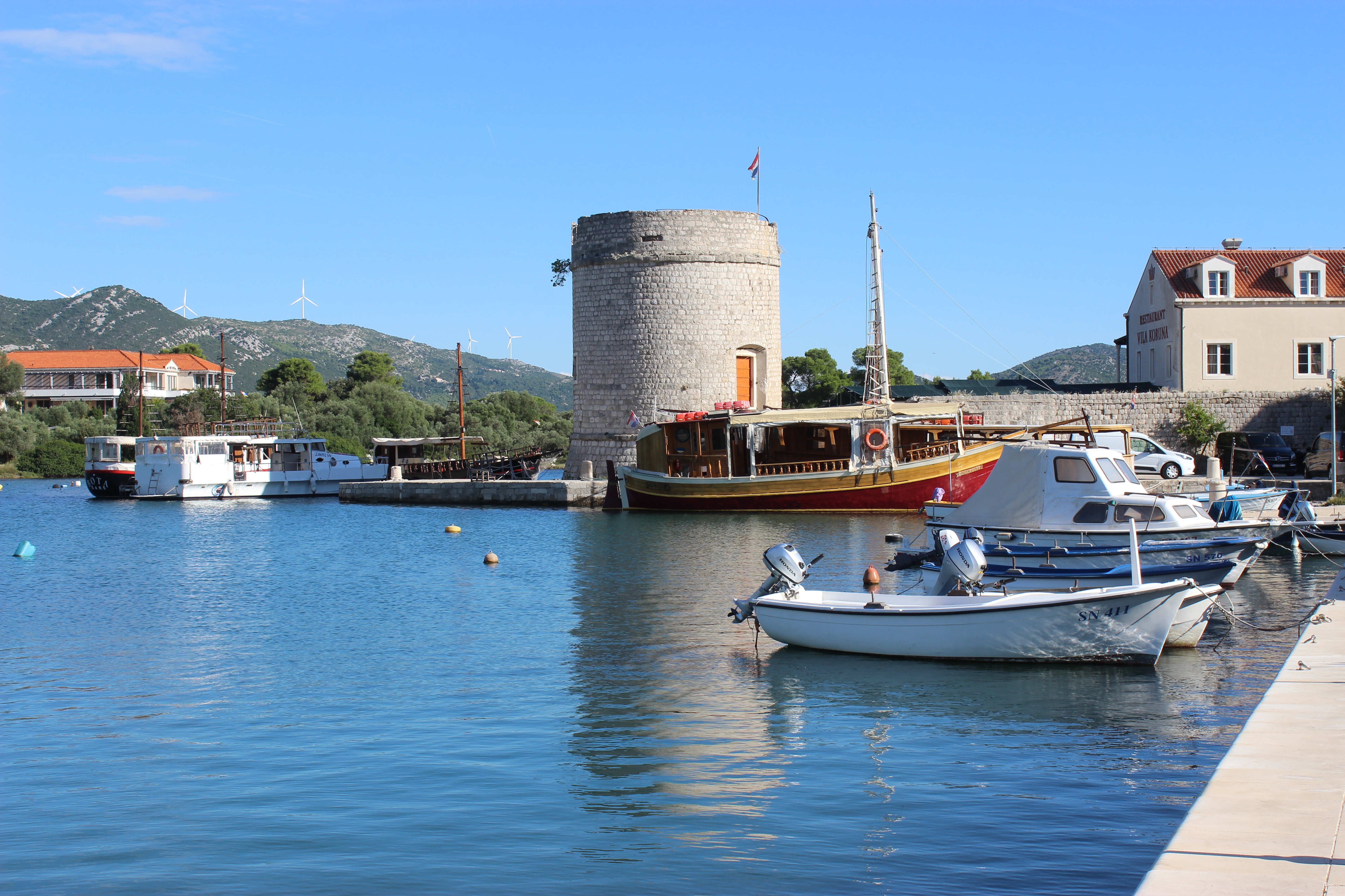 Mali Ston harbor with stone tower in the background.