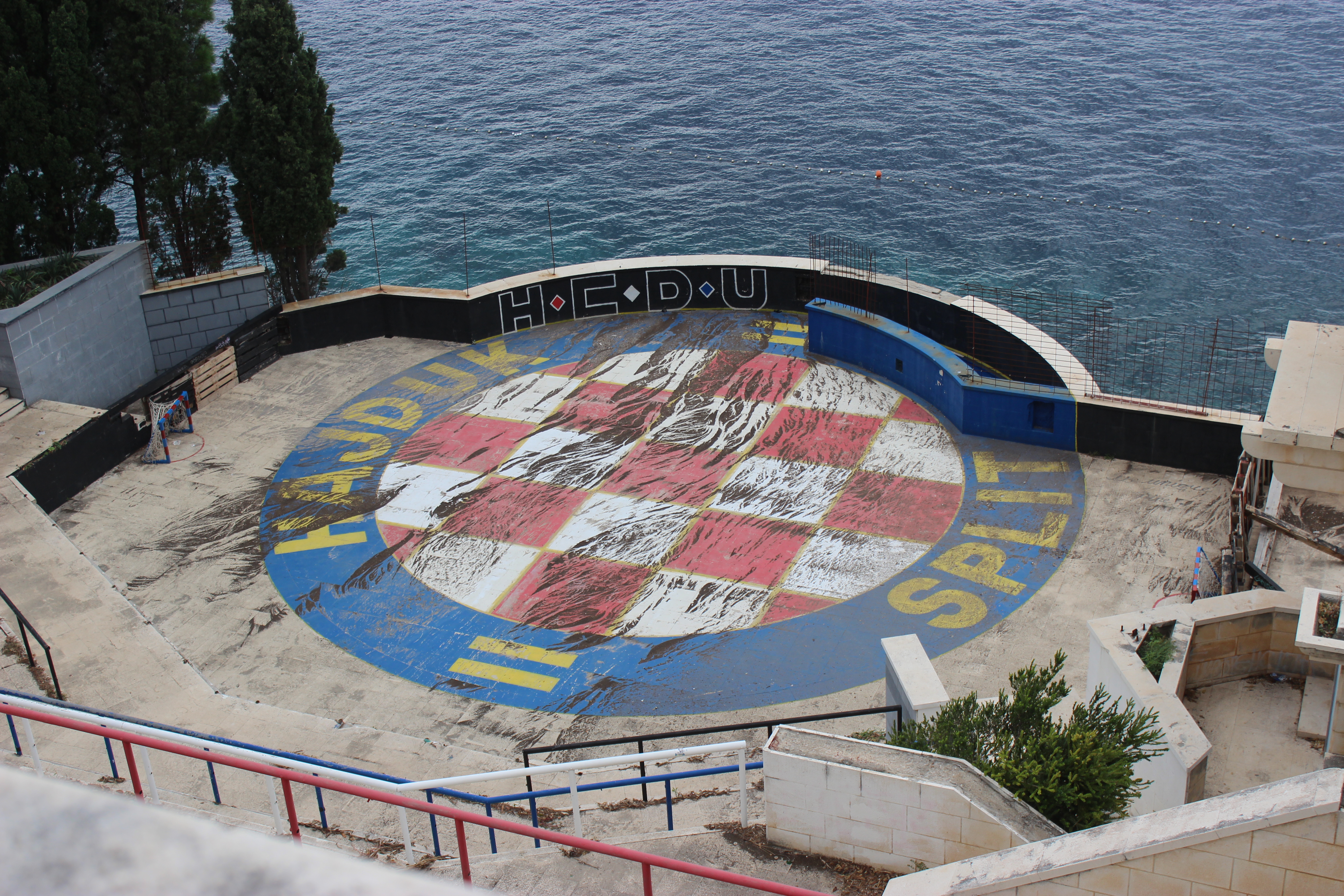 A weathered stone courtyard in Hotel Belvedere with the symbol of Croatia's soccer team. 