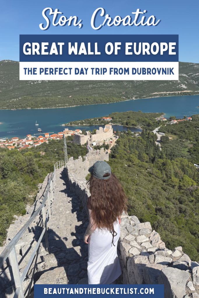 An image of a woman with thick brown hair staring out upon Mali Ston from a viewpoint on the Ston Walls in Ston, Croatia. The text reads, "Ston, Croatia, Great Wall of Europe, The Perfect Day Trip from Dubrovnik" with the website title, beautyandthebucketlist.com at the bottom.