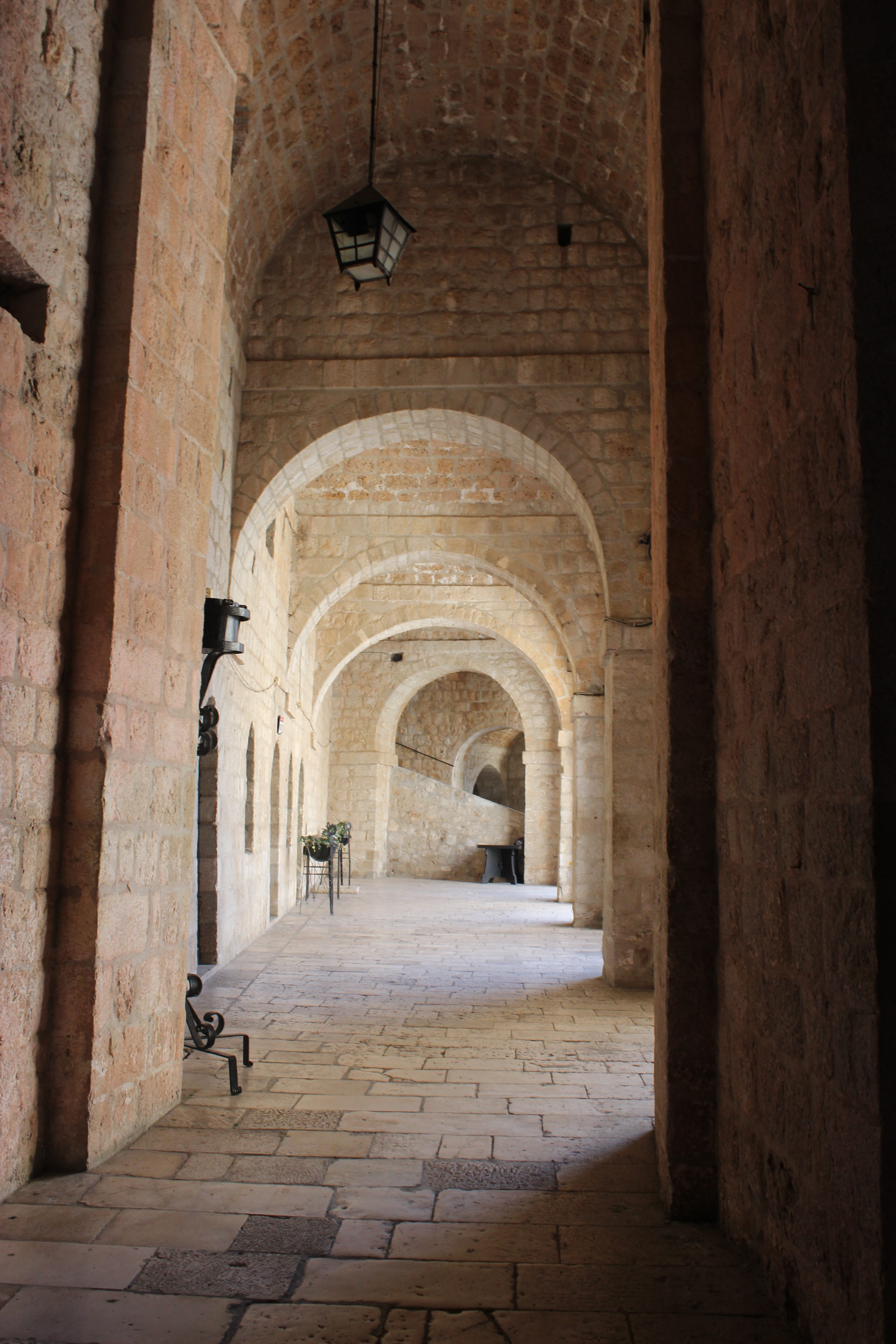 A shadowed stone hallway in Fort Lovrijenac.