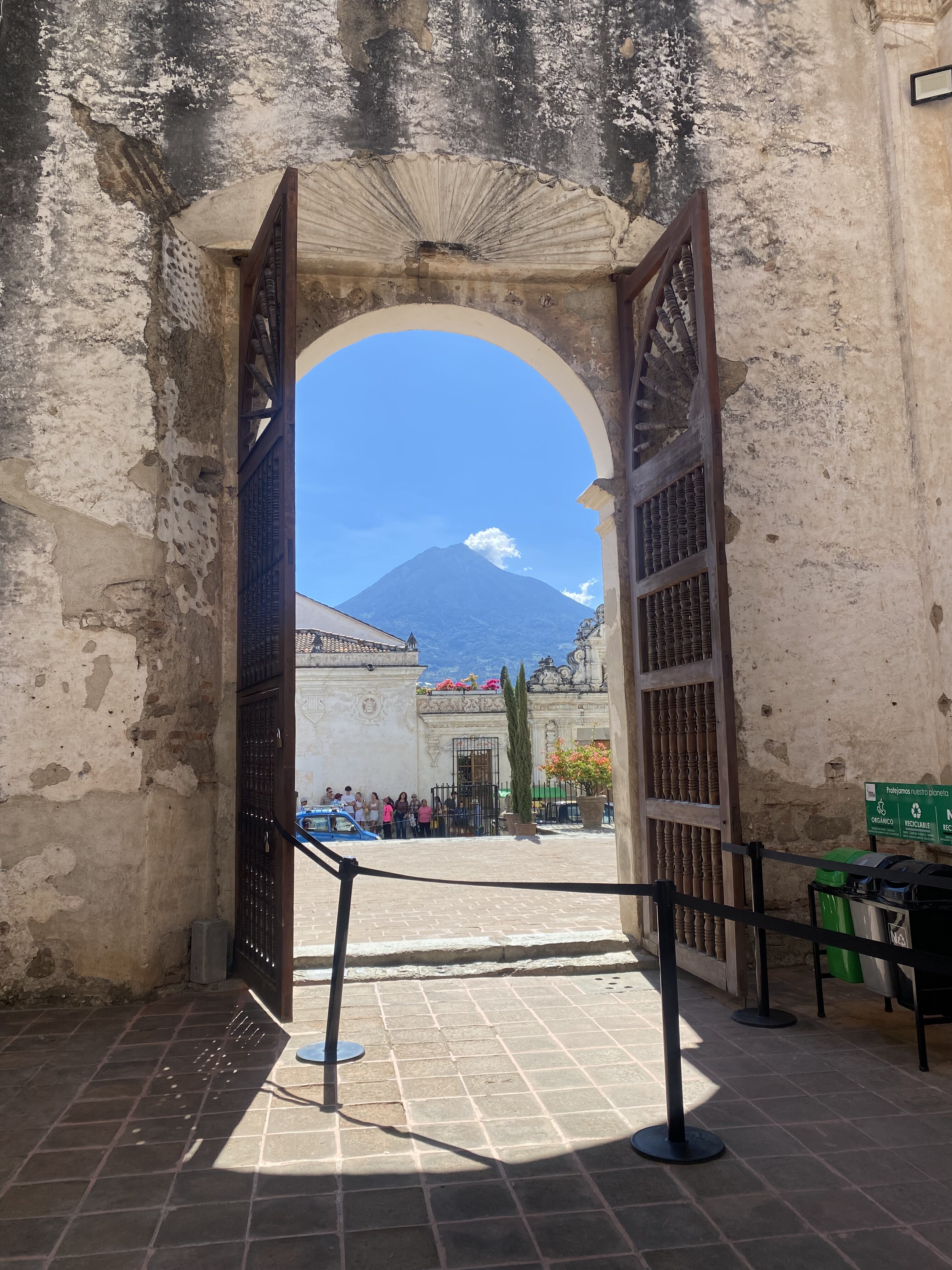 Agua Volcano seen from the weathered doorway of Catedral de San José (Ruins).