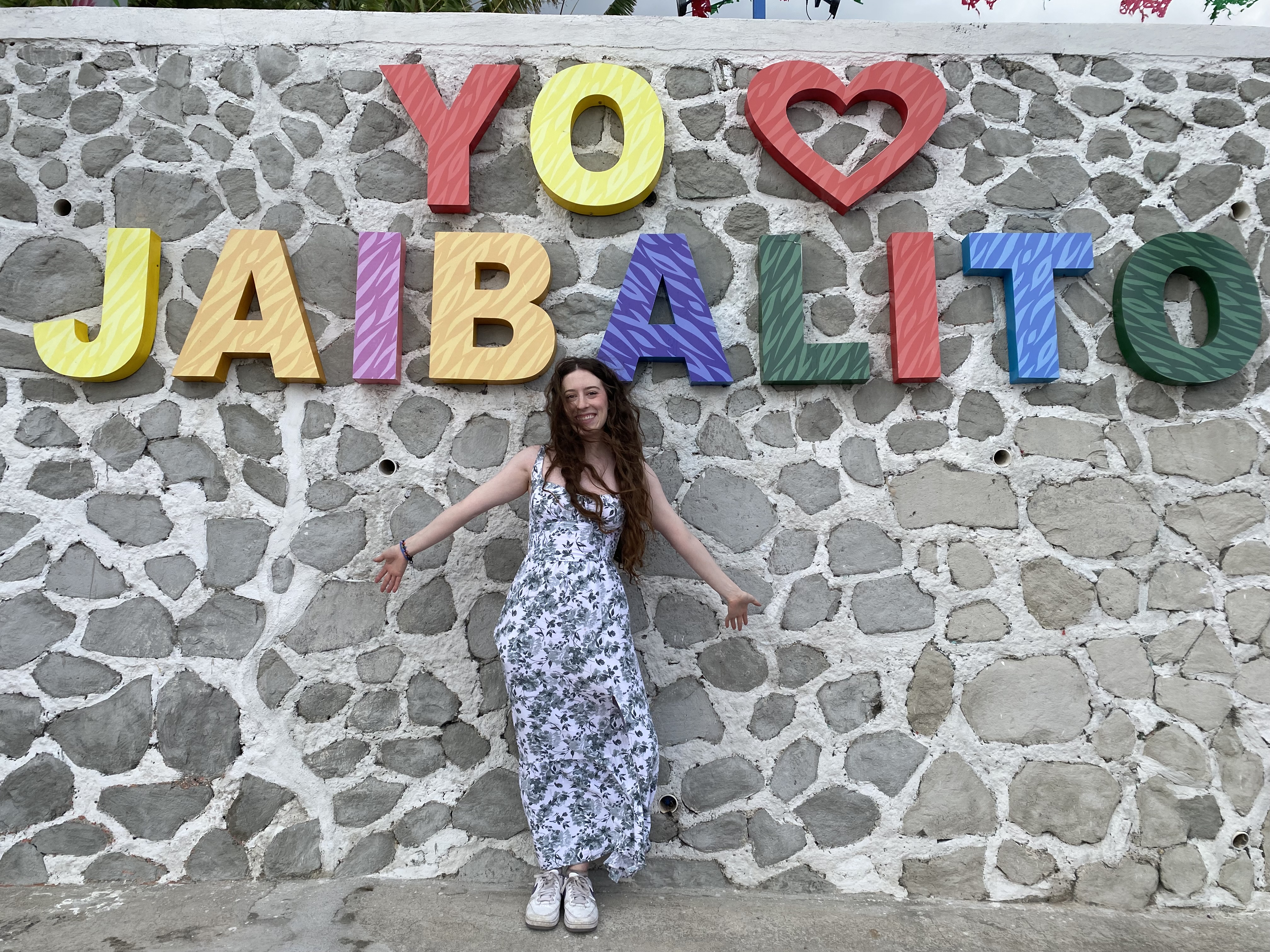 Bella, posing in front of the Jaibalito sign.