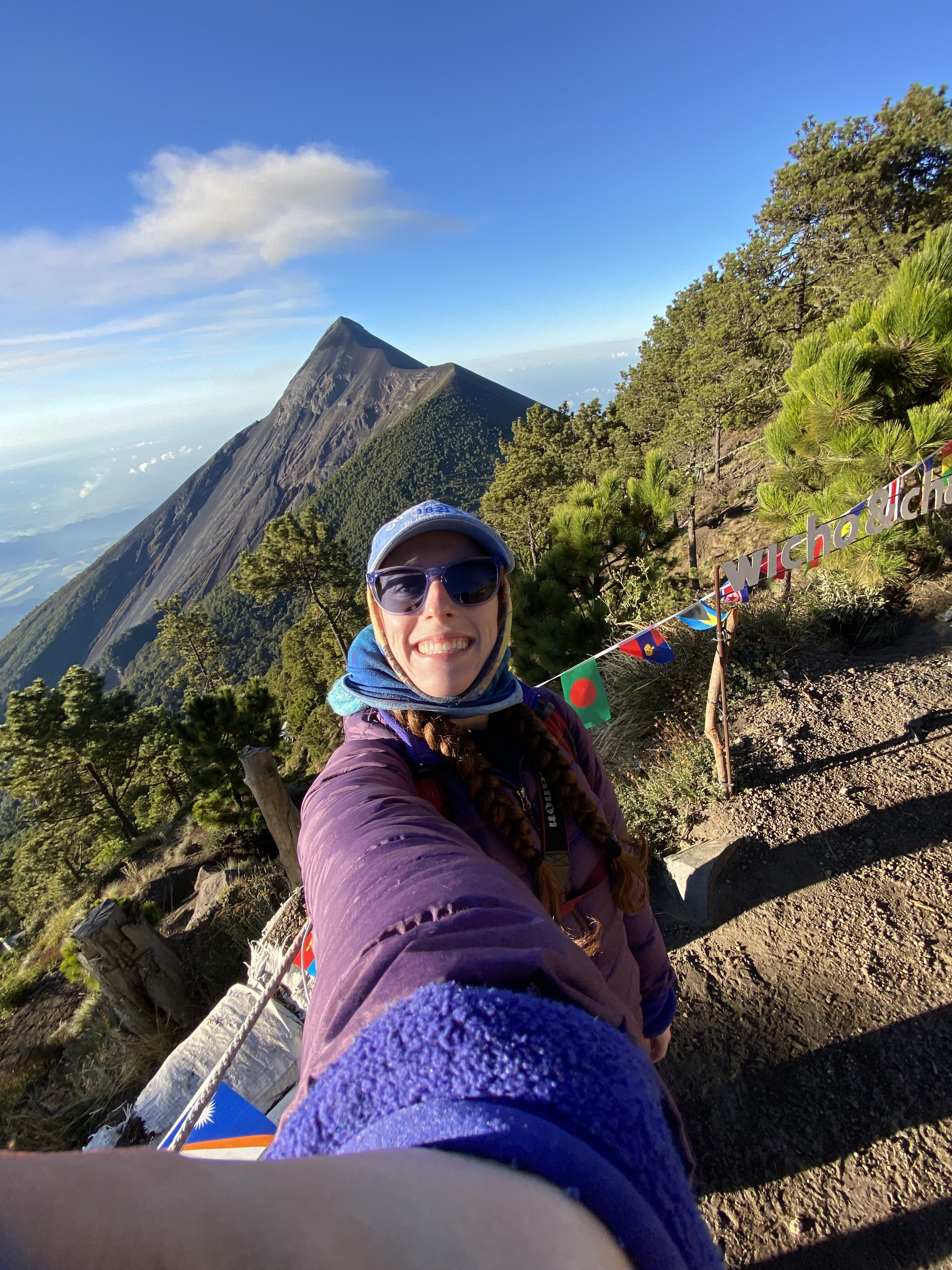 Bella taking a selfie at Acatenango base camp in front of Fuego Volcano.