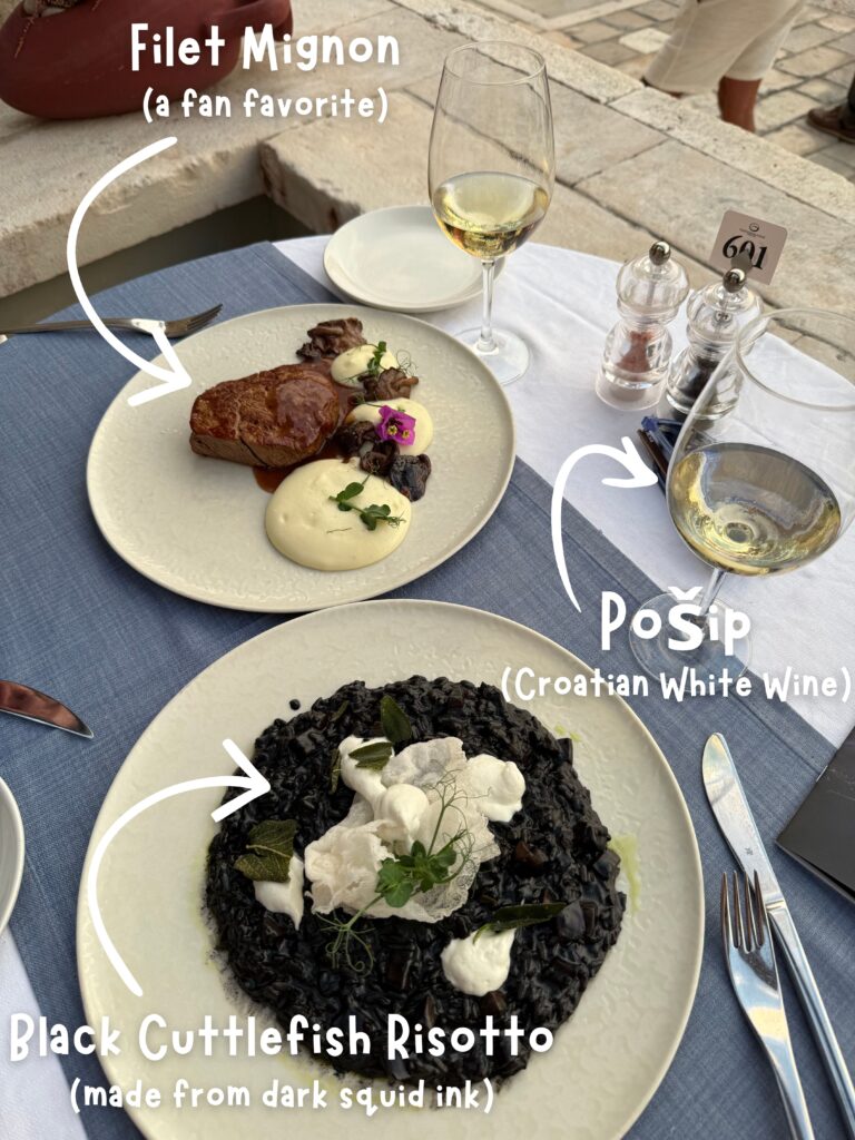 An image of two dinner plates with arrows and descriptions pointing to the dishes. The descriptions say "Black Cuttlefish Risotto, made from dark squid ink", "Pošip, Croatian White Wine", and "Filet Mignon, a fan favorite".