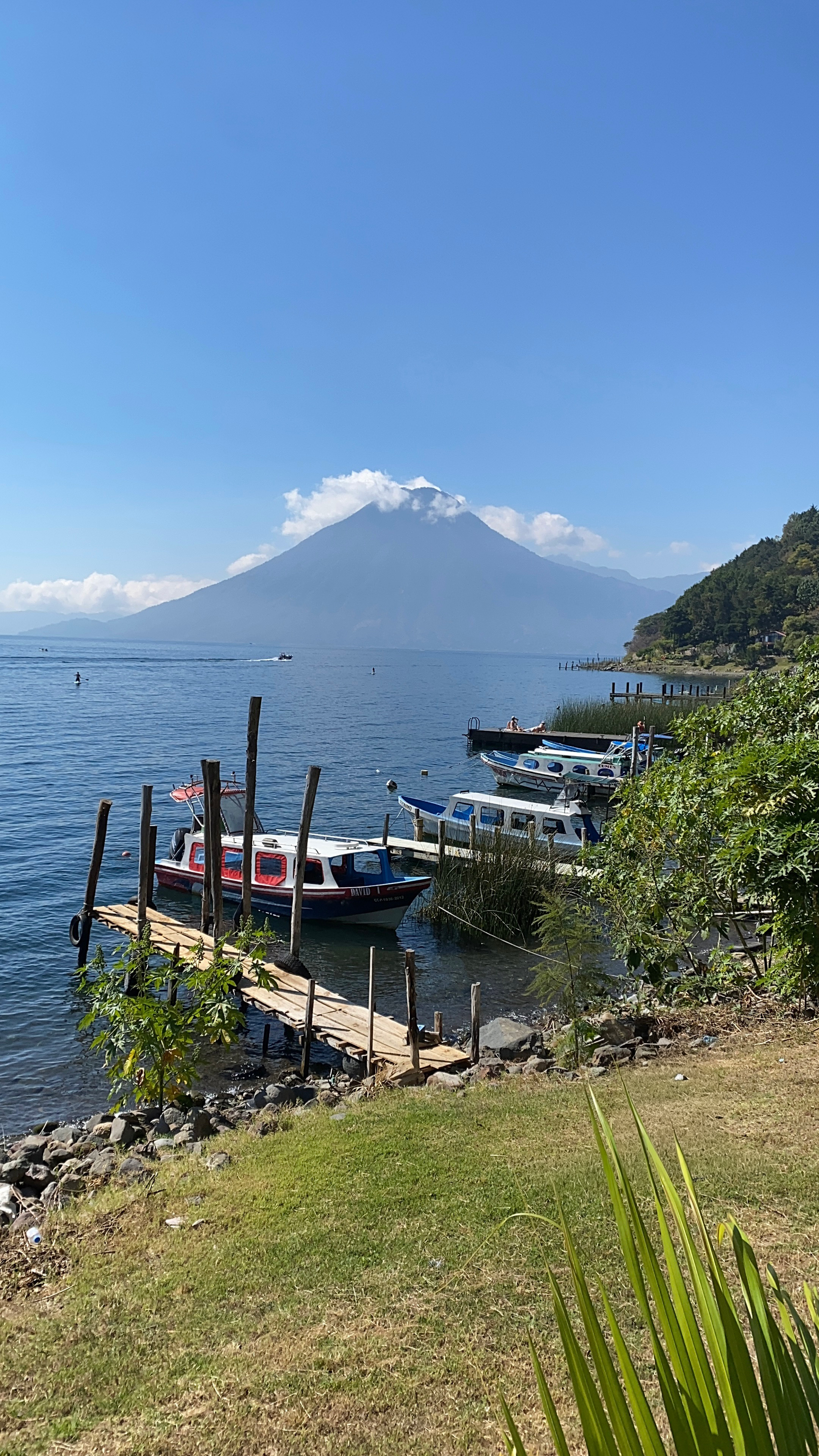 Santa Cruz (Lake Atitlán) with view of dock and San Pedro Volcano in background.