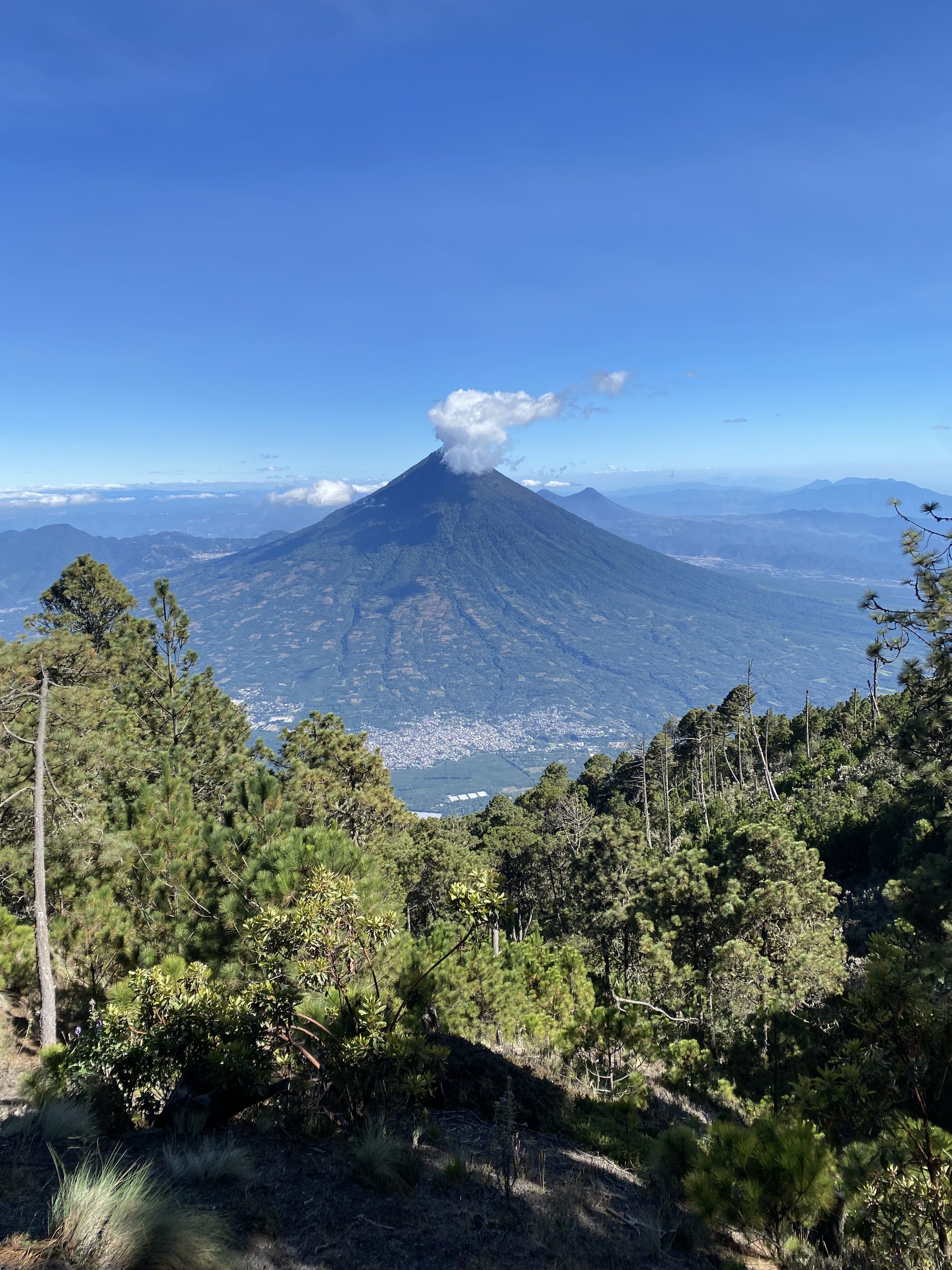 An inactive volcano with a cloud-covered summit along the Acatenango hiking trail.
