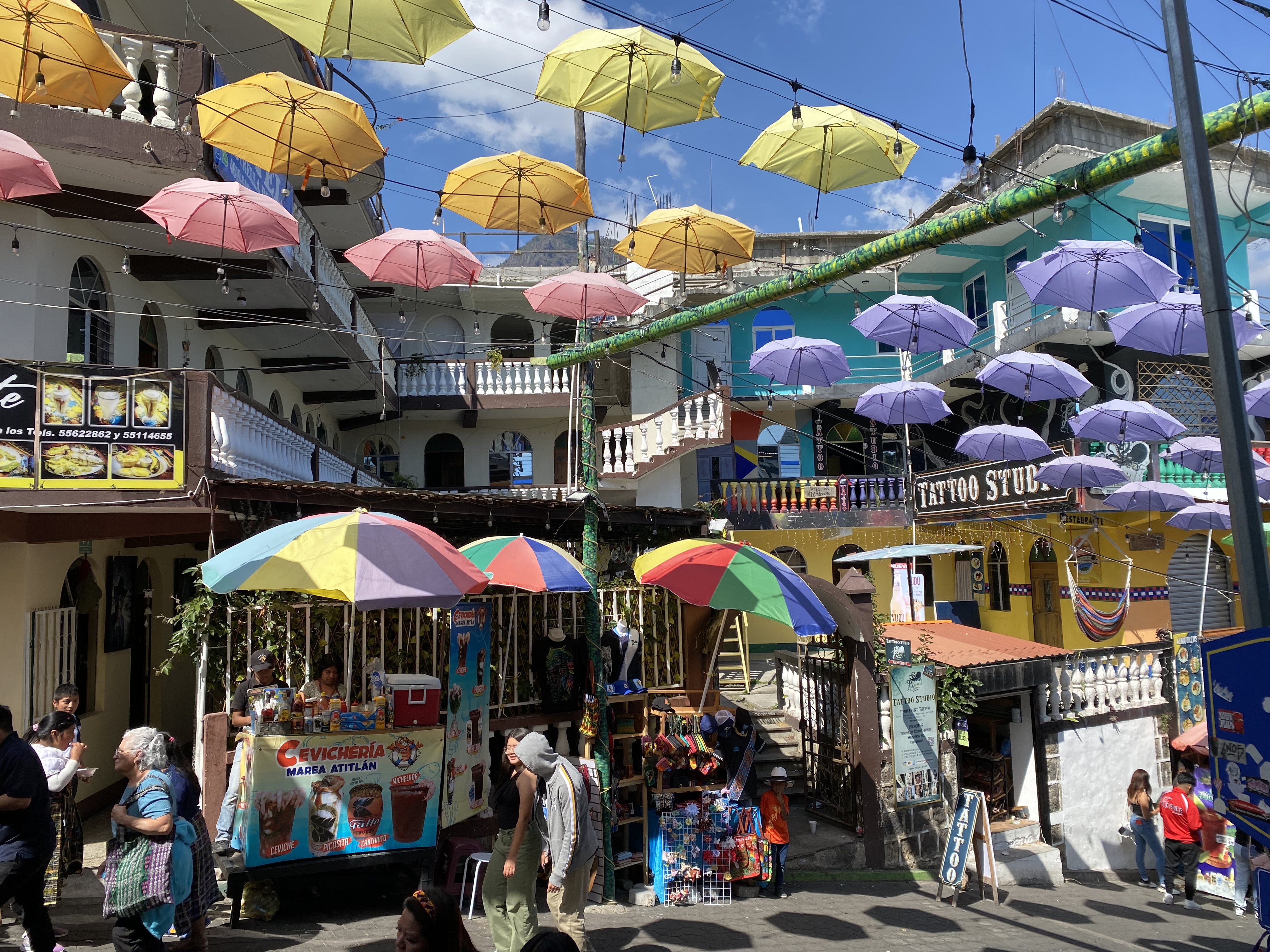 Colorful umbrellas hanging over the streets of San Juan La Laguna.