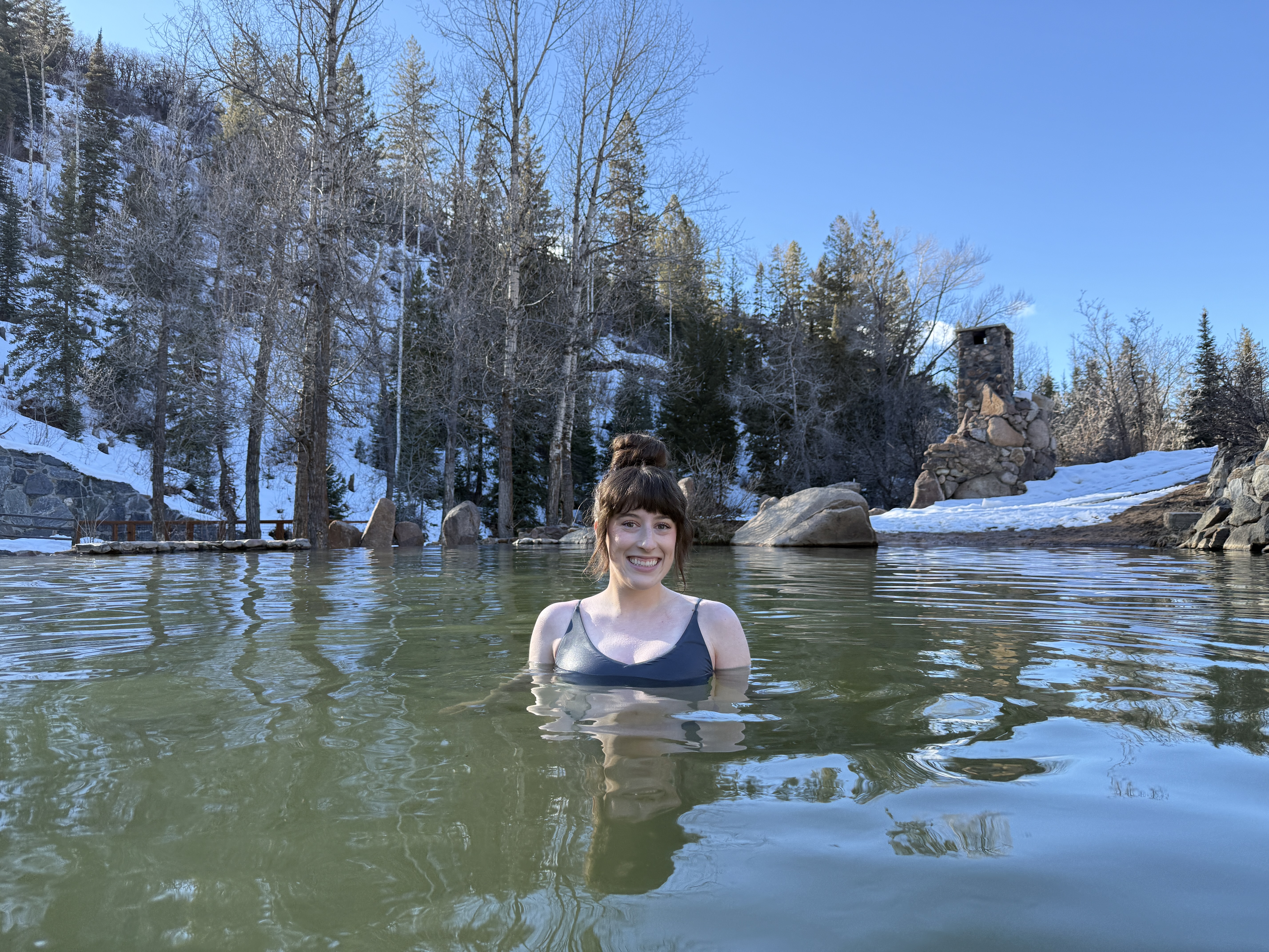 Bella smiling in a cold pool at Strawberry Park Hot Springs.