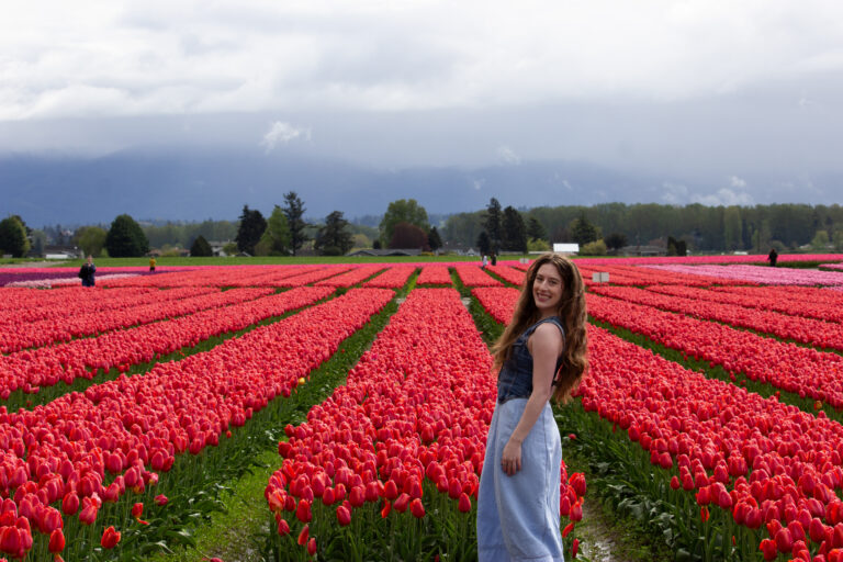 Red tulips at RoozenGaarde (Bella posing).