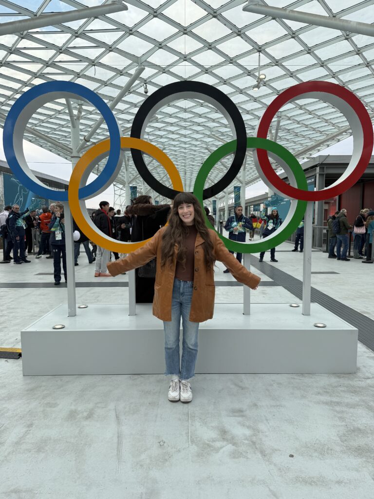 Bella posing with Olympic rings (Milano-Cortina 2026)