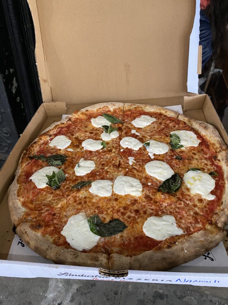 A large basil and burrata cheese pizza from L'Industrie Pizza in NYC.