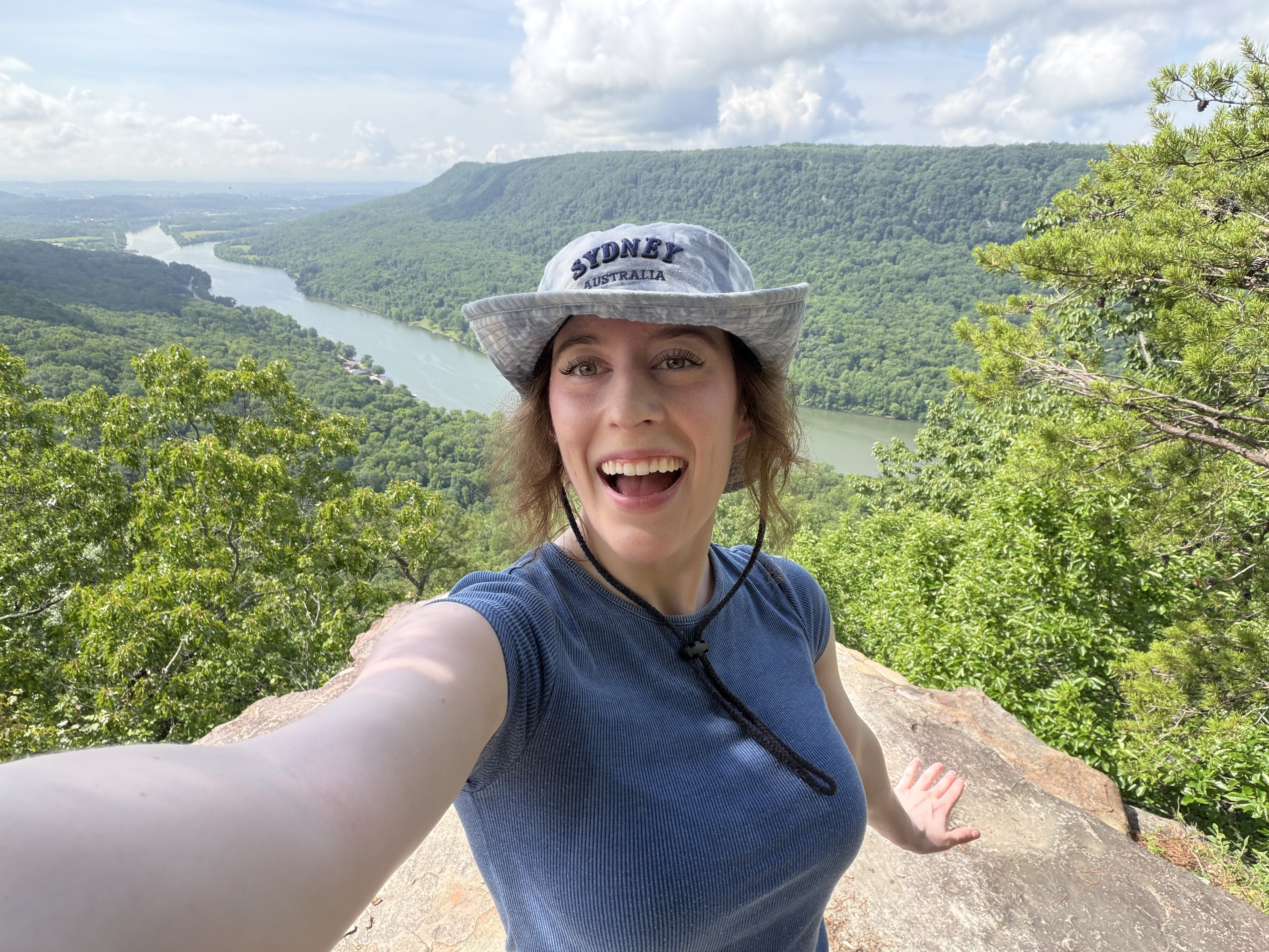 Bella, smiling selfie at Edward's Point with Tennessee River Gorge in background.