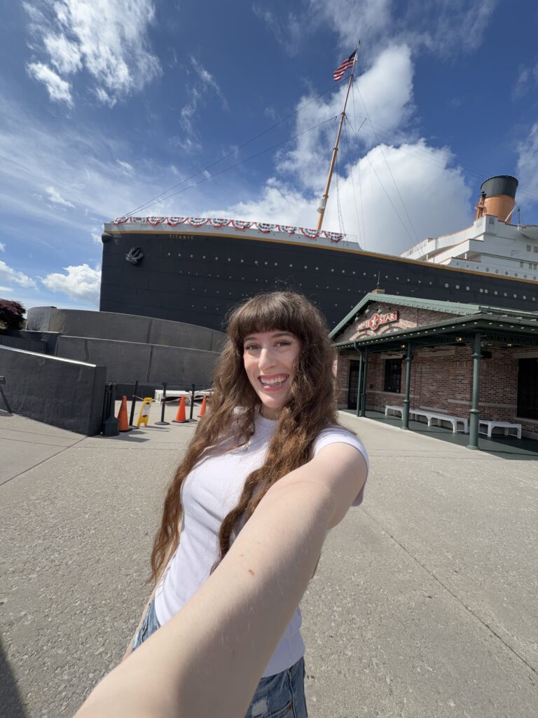 Bella smiling (selfie) in front of the Titanic Museum, Pigeon Forge.