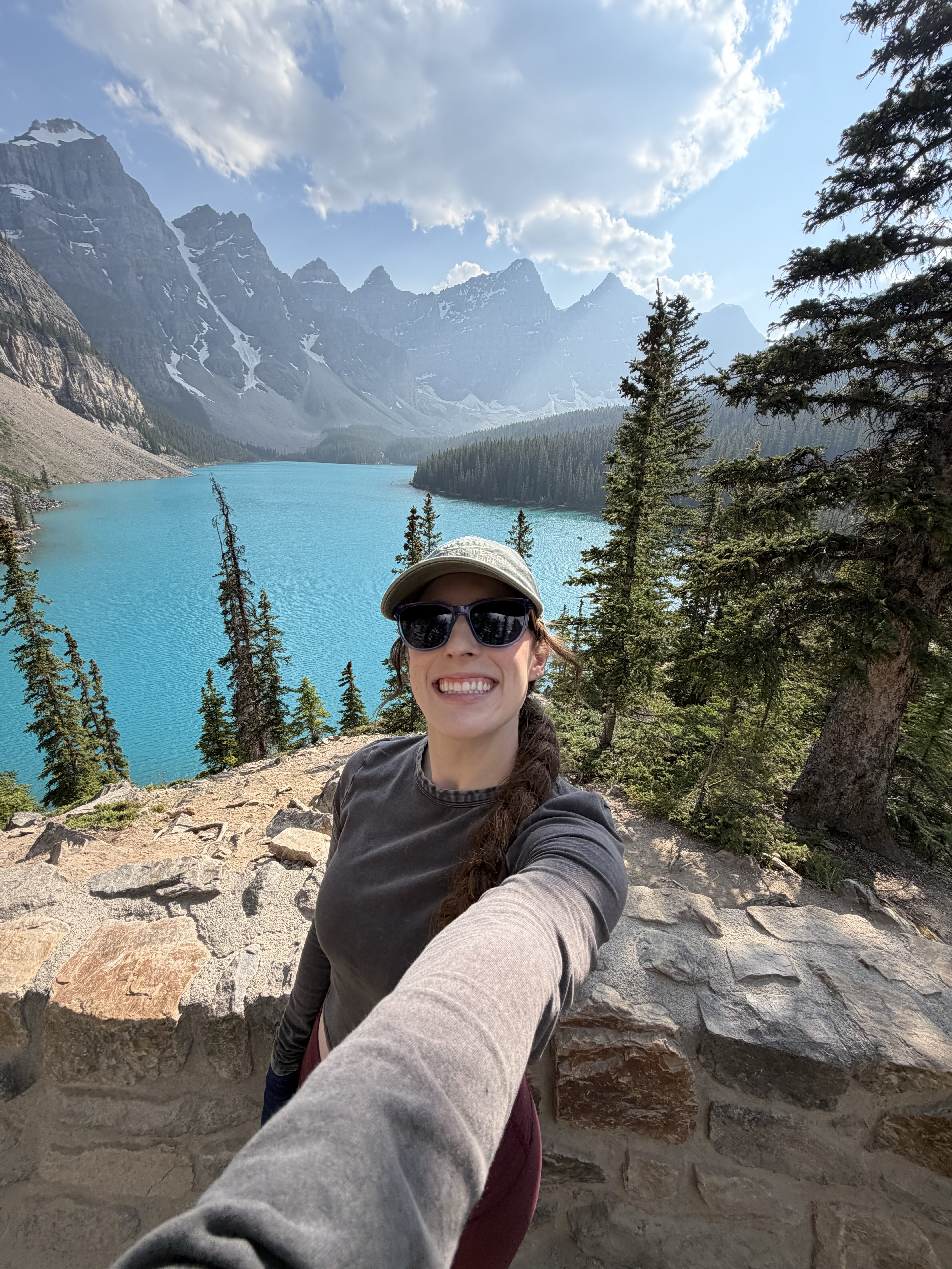 Bella taking a selfie at the top of the rock pile at Moraine Lake.